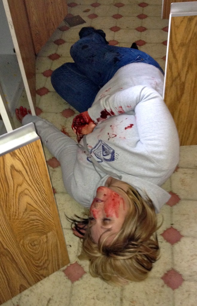 Role player with casualty simulation during police medical training by Lazarus Training.